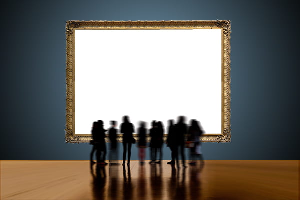 Group of silhouetted people standing in front of large white canvas on blue wall.